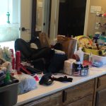 cluttered bathroom vanity
