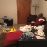 couch with clothes on it