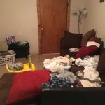 couch with clothes on it