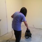 cleaner vacuuming a rug